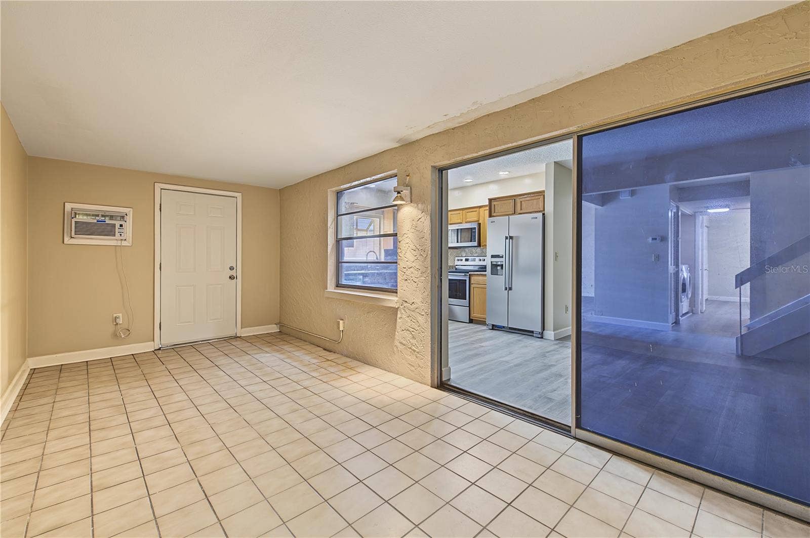 2729 FOXFIRE COURT, #C, Clearwater, FL 33761 Side patio off of the kitchen.