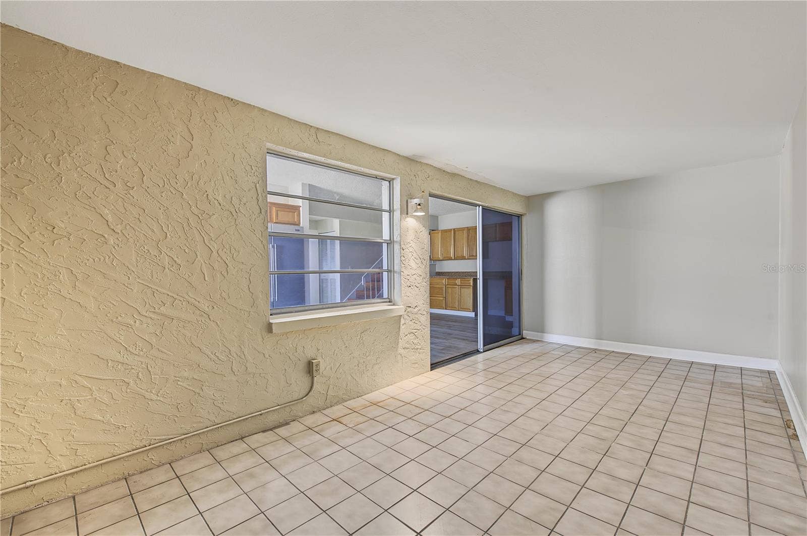 2729 FOXFIRE COURT, #C, Clearwater, FL 33761 Side Patio off of the kitchen.