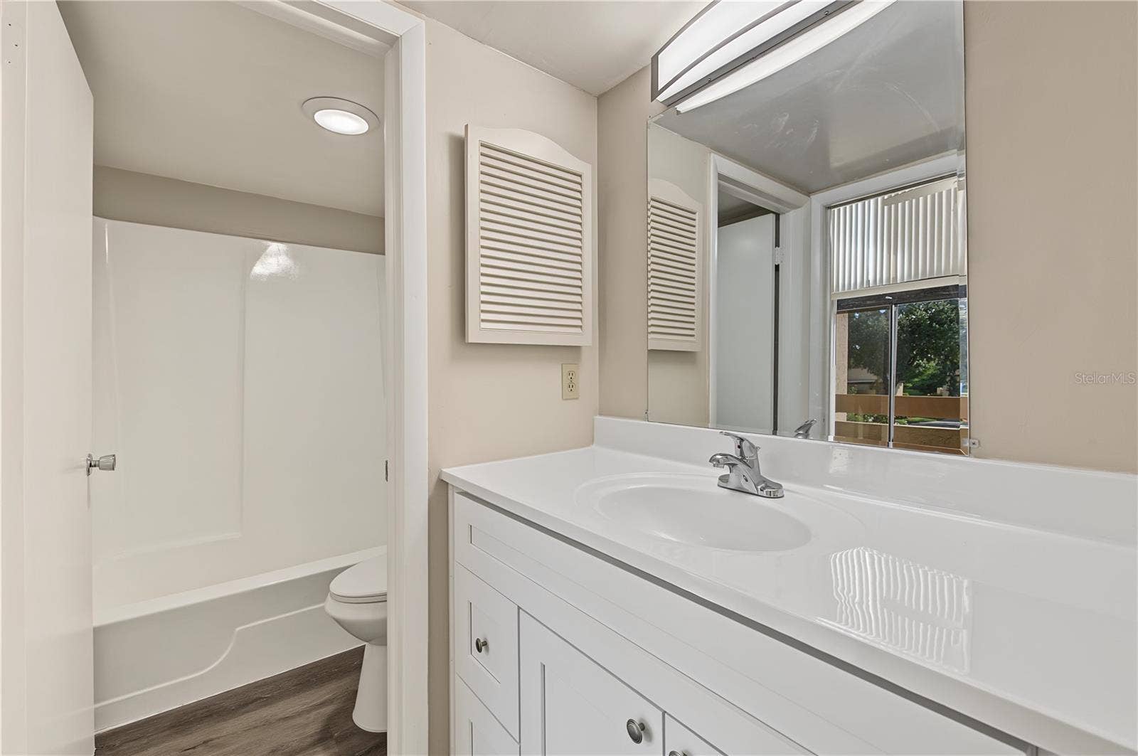 2729 FOXFIRE COURT, #C, Clearwater, FL 33761 Bathroom, new light fixture and laminate flooring.