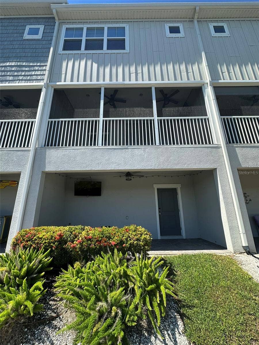 6072 MOORINGS DRIVE S, St Petersburg, FL 33712 Back side of townhome, two outdoor spaces on the water