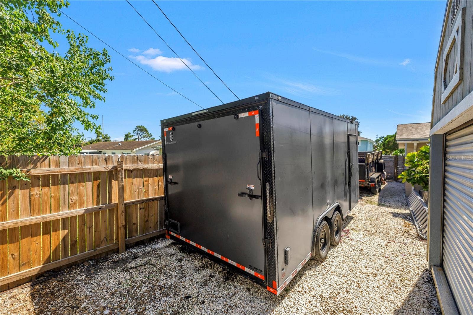 The current owner has two of his trailers parked here and plenty of room left over. You could fit all sorts of big toys back here, protected by a locked access gate up front.