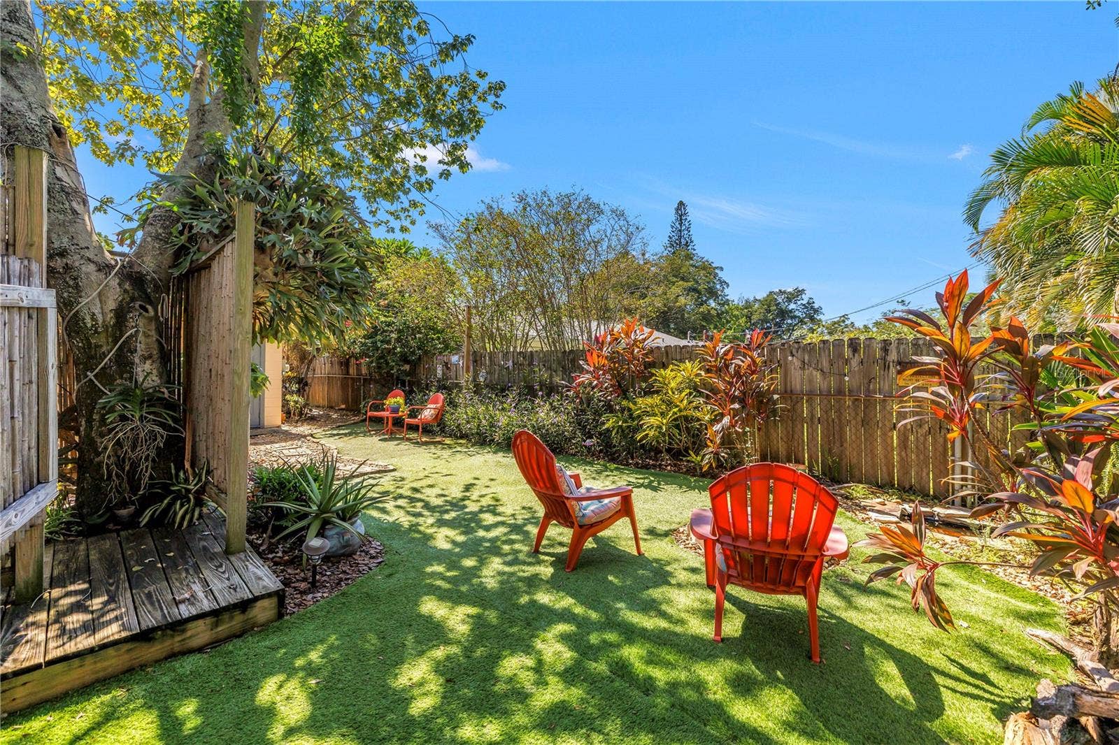 Turf throughout the backyard helps cut maintenance.