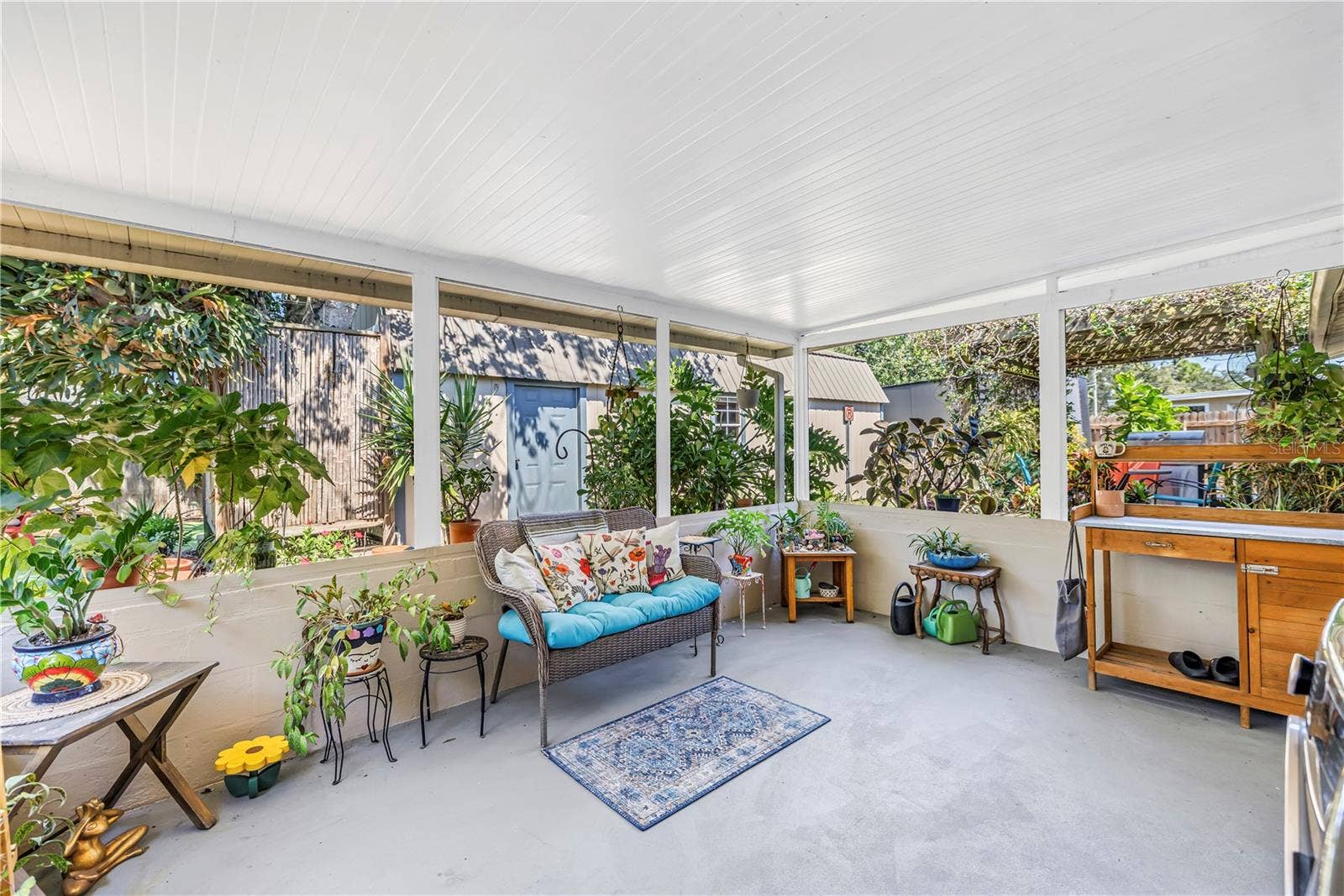 Peaceful covered back porch right out of the kitchen