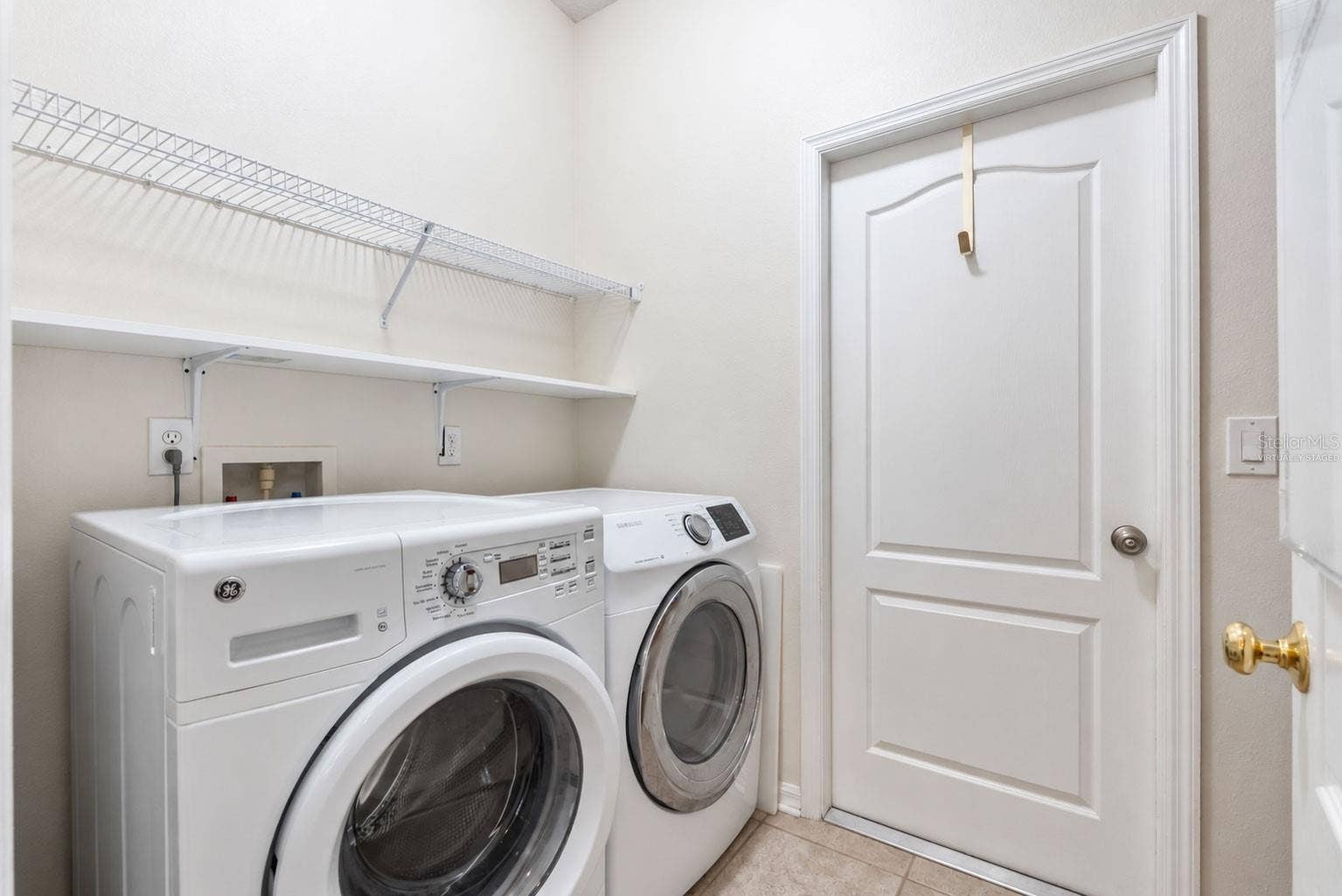 8121 BRINEGAR CIRCLE, Tampa, FL 33647 Virtually Staged-Laundry Room (Laundry room was decluttered)