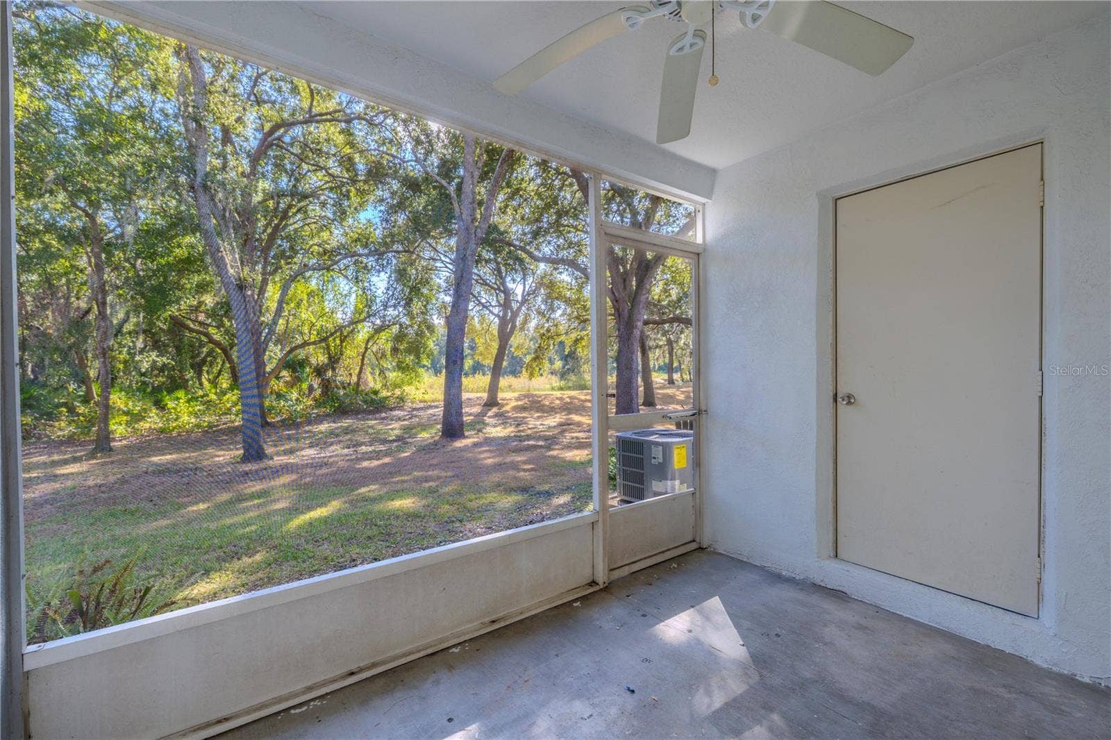 2432 LAKE WOODBERRY CIRCLE, Brandon, FL 33510 The private screened in porch has additional storage.