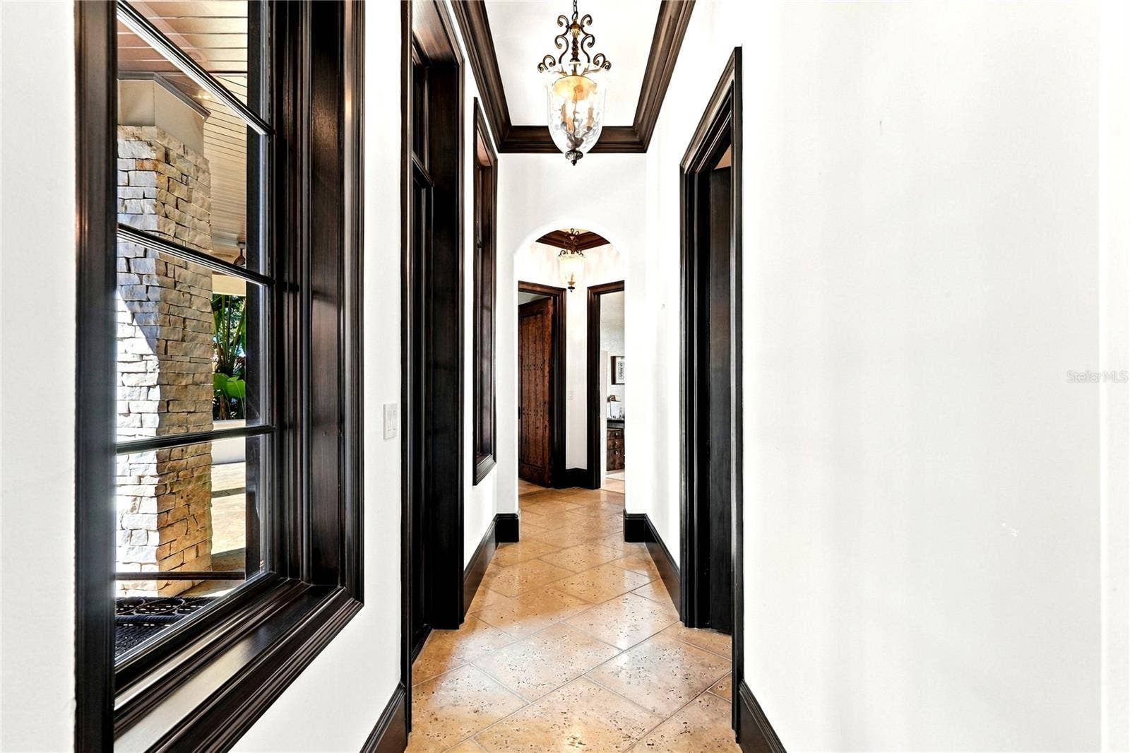 200 BRIGHTWATERS BOULEVARD NE, St Petersburg, FL 33704 Hallway to first level primary bedroom