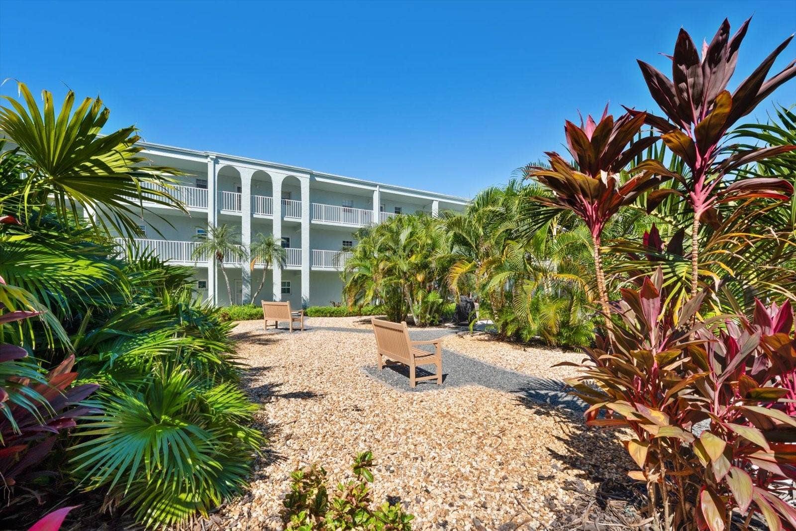 1706 BELLEAIR FOREST DRIVE, #238, Belleair, FL 33756 Courtyard with lush tropical landscaping