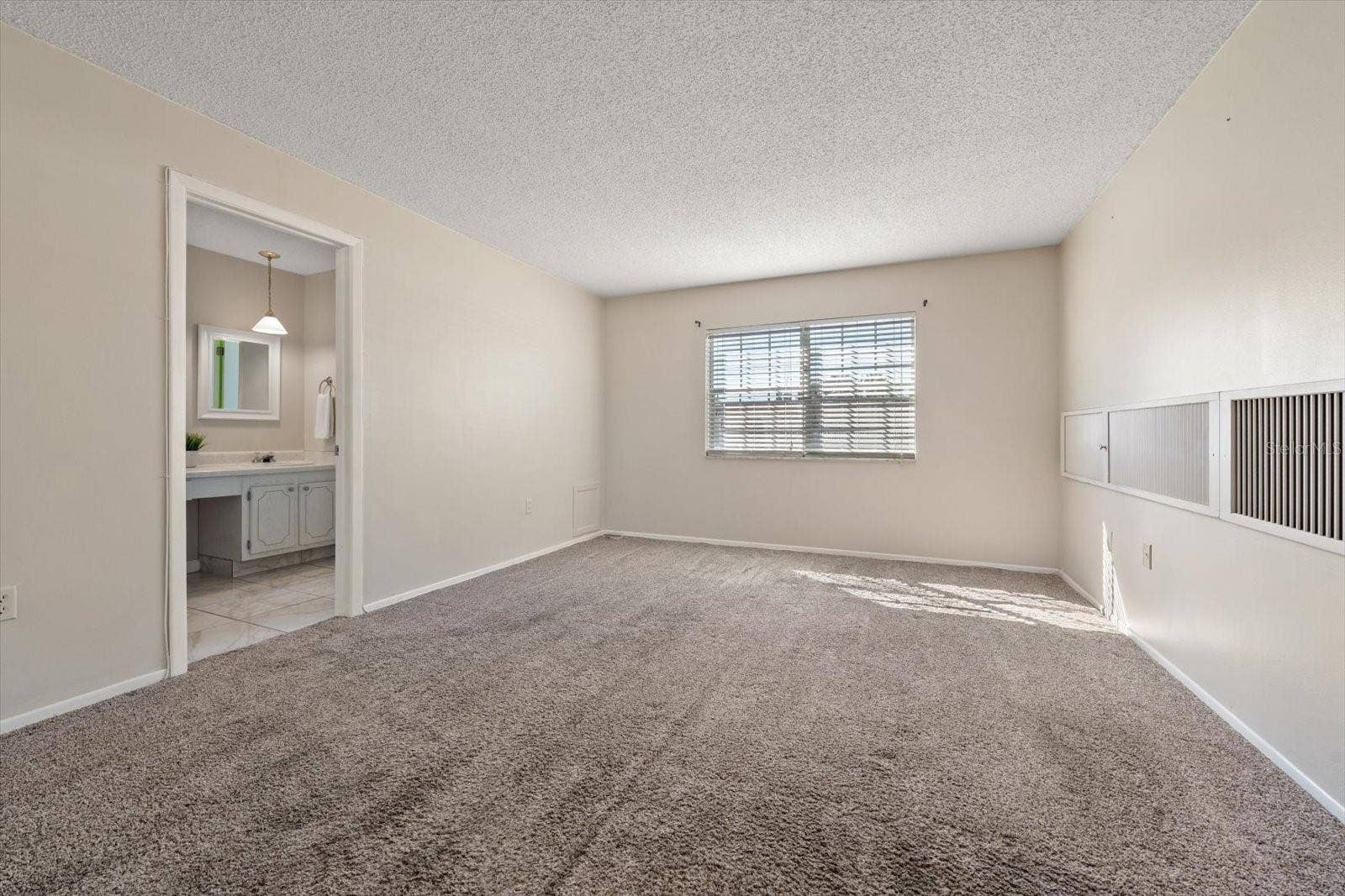 1706 BELLEAIR FOREST DRIVE, #238, Belleair, FL 33756 Primary suite with additional closet, en suite bath and walk in closet