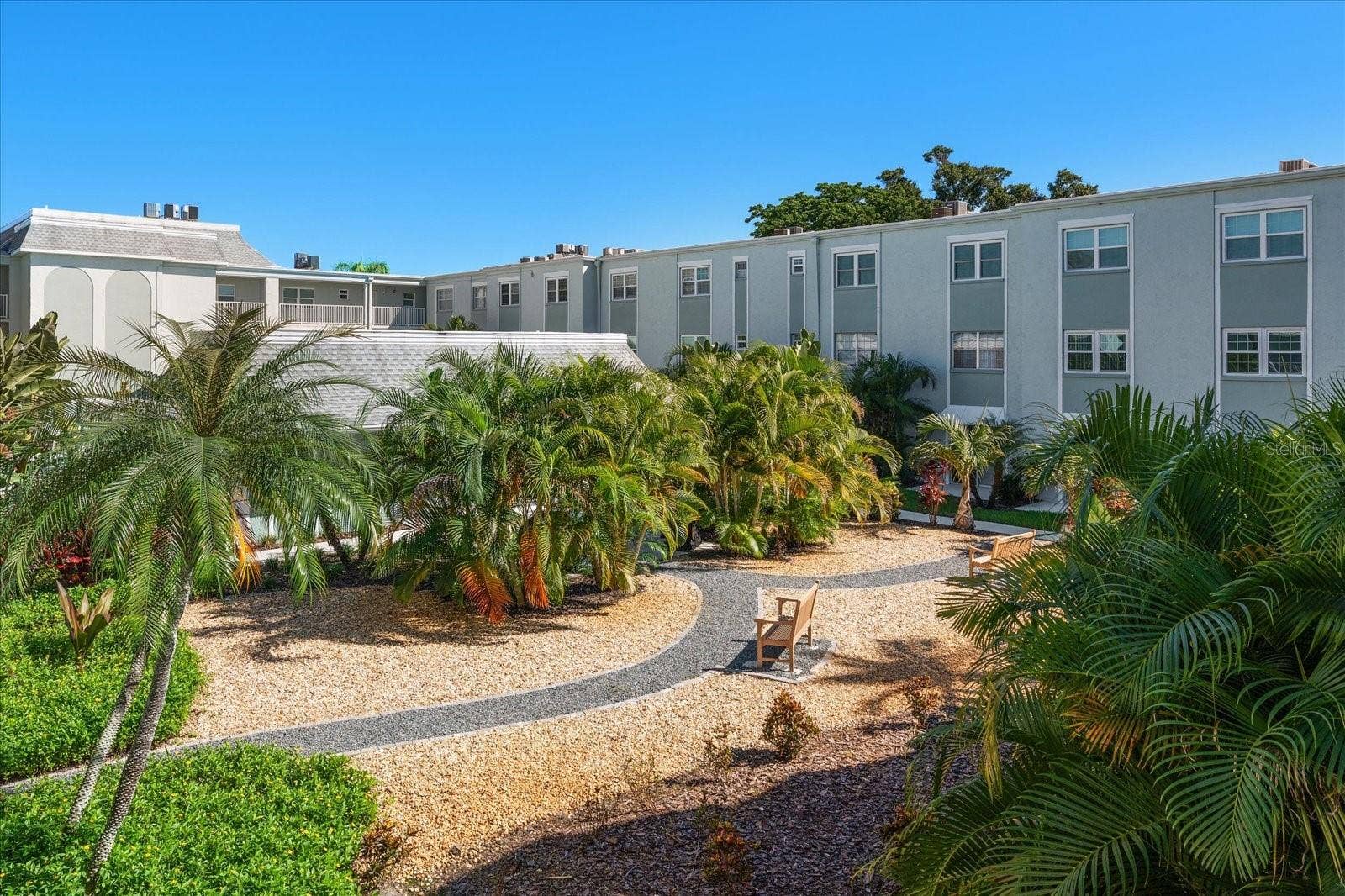 1706 BELLEAIR FOREST DRIVE, #238, Belleair, FL 33756 Courtyard with lush tropical landscaping