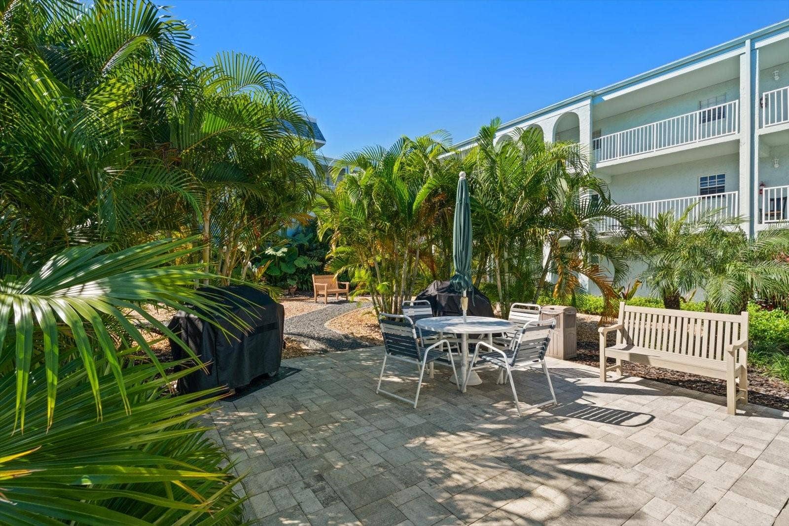 1706 BELLEAIR FOREST DRIVE, #238, Belleair, FL 33756 Courtyard with lush tropical landscaping