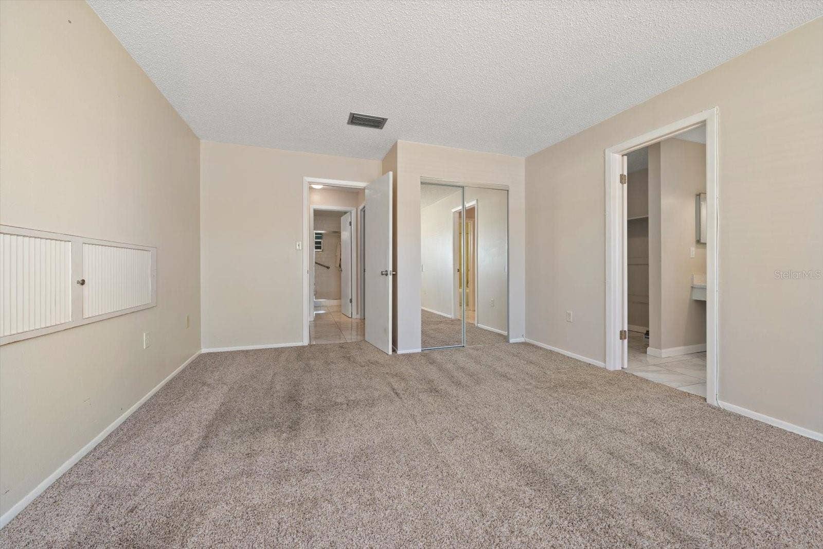1706 BELLEAIR FOREST DRIVE, #238, Belleair, FL 33756 Primary suite with additional closet, en suite bath and walk in closet