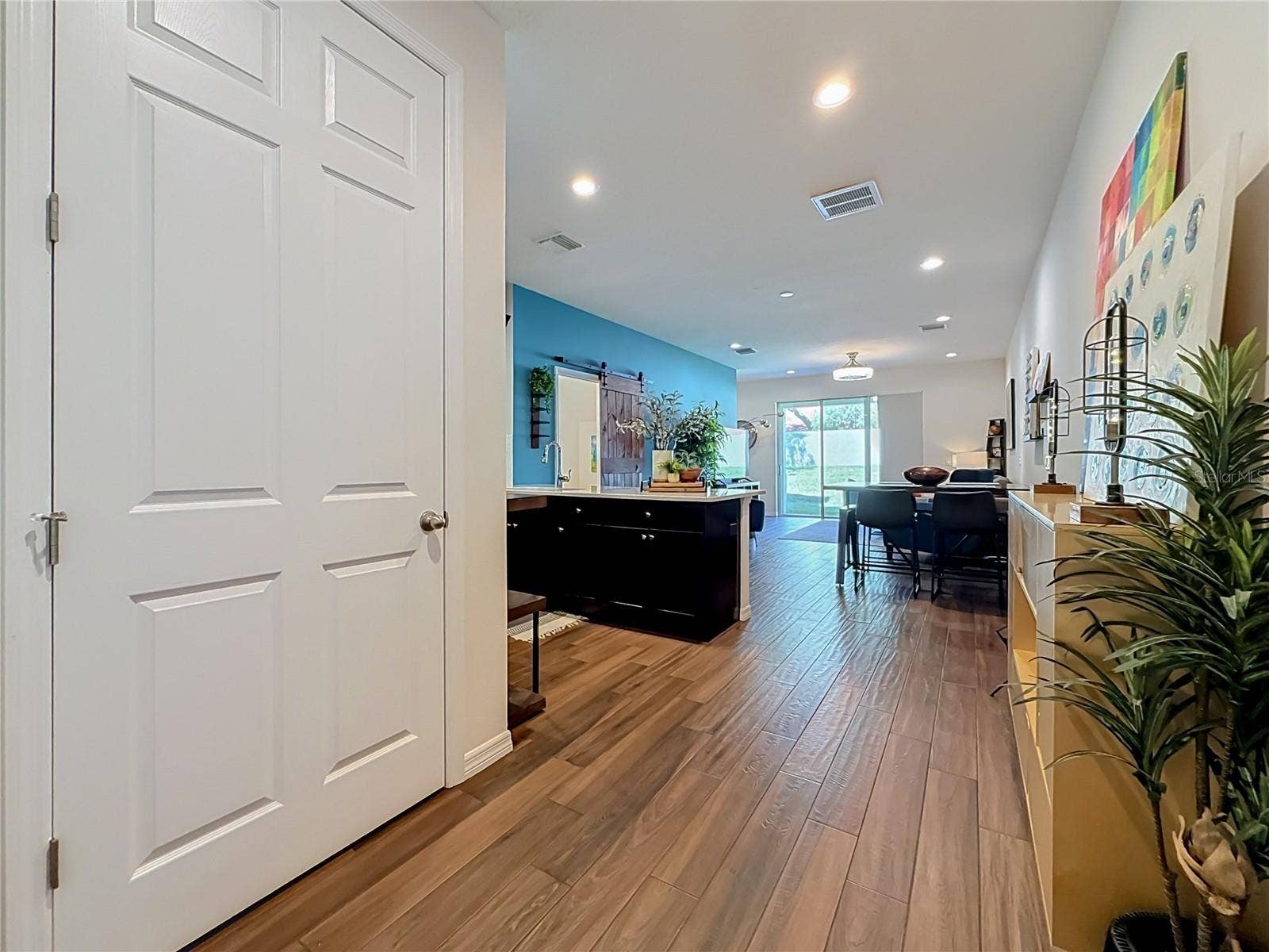 2270 MONTVIEW DRIVE, Clearwater, FL 33763 Step inside to discover a spacious OPEN FLOOR PLAN with soaring ceilings and beautiful WOOD-LOOK TILE flooring throughout the downstairs living areas.