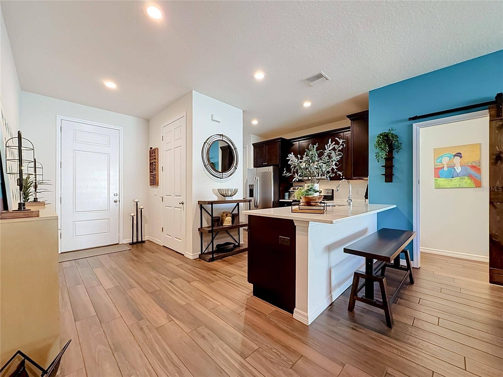 2270 MONTVIEW DRIVE, Clearwater, FL 33763 Step inside to discover a spacious OPEN FLOOR PLAN with soaring ceilings and beautiful WOOD-LOOK TILE flooring throughout the downstairs living areas.