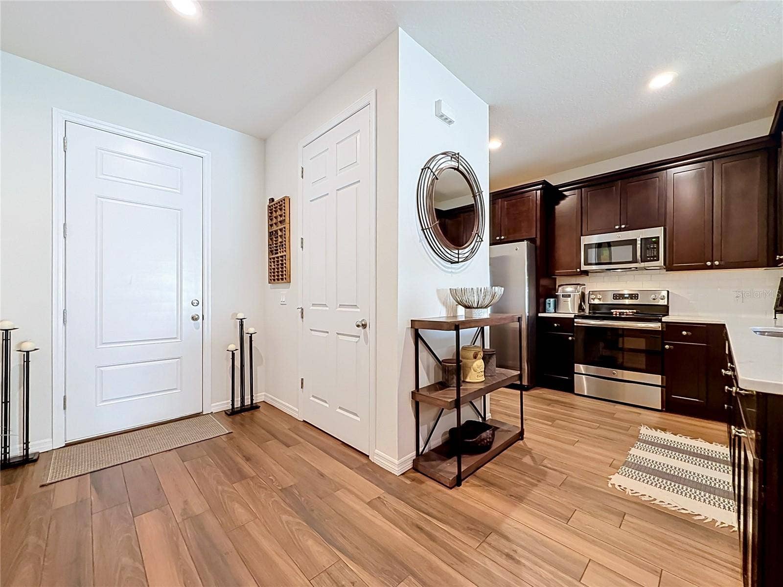 2270 MONTVIEW DRIVE, Clearwater, FL 33763 Step inside to discover a spacious OPEN FLOOR PLAN with soaring ceilings and beautiful WOOD-LOOK TILE flooring throughout the downstairs living areas.