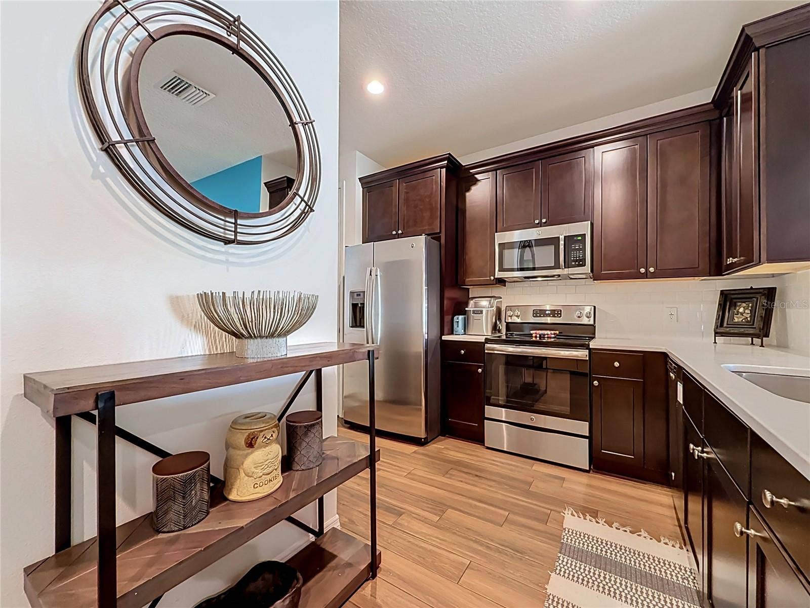 2270 MONTVIEW DRIVE, Clearwater, FL 33763 The well-appointed kitchen offers SOLID WOOD CABINETRY, GRANITE countertops, stainless steel appliances, a breakfast bar, and ample storage.