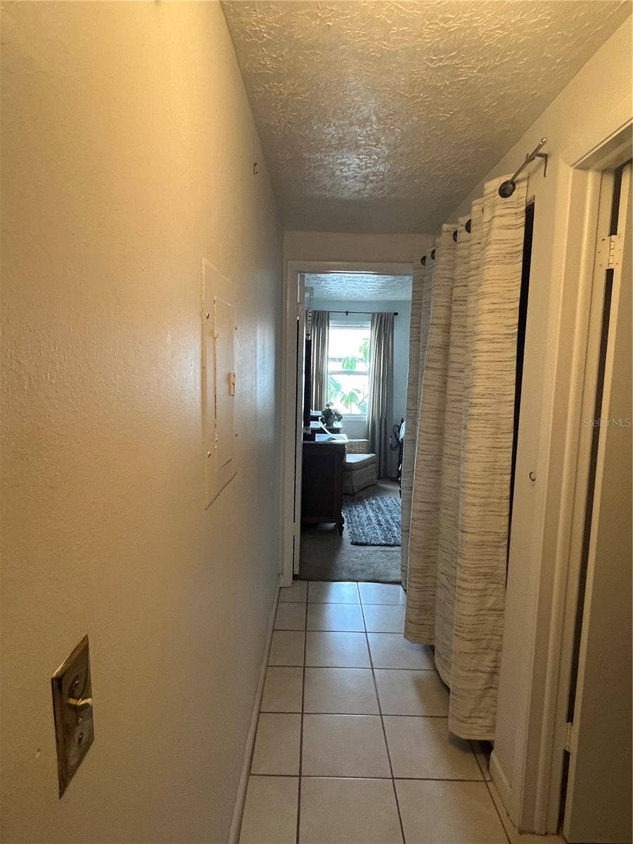 Laundry hallway between bedrooms