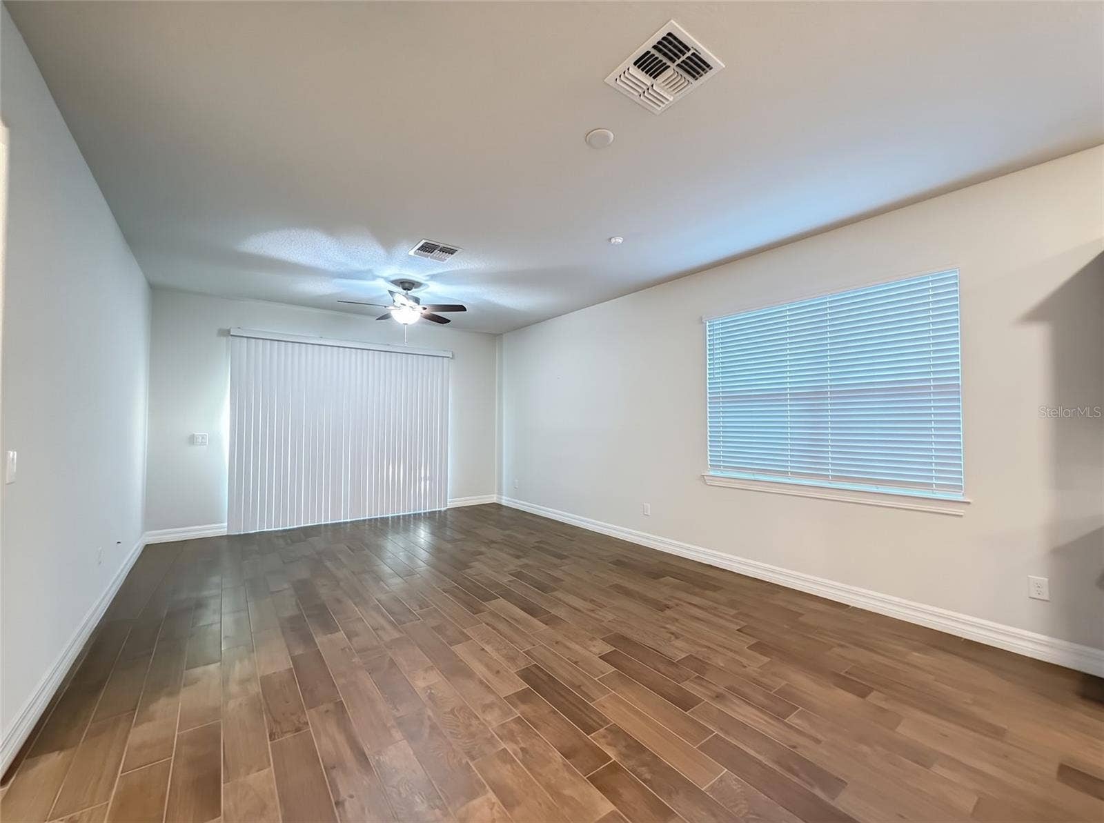 19420 SHIP WHEEL WAY, Land O Lakes, FL 34638 Living Room with Sliders to Screened Porch
