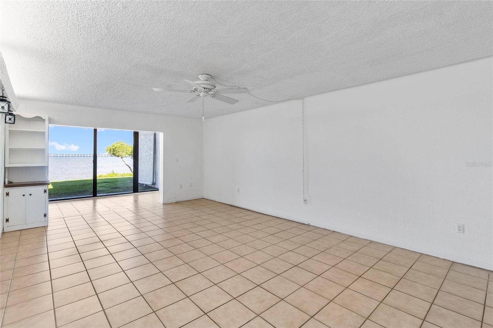 2980 HAINES BAYSHORE ROAD, #105, Clearwater, FL 33760 Living area from other side - looking towards water view.