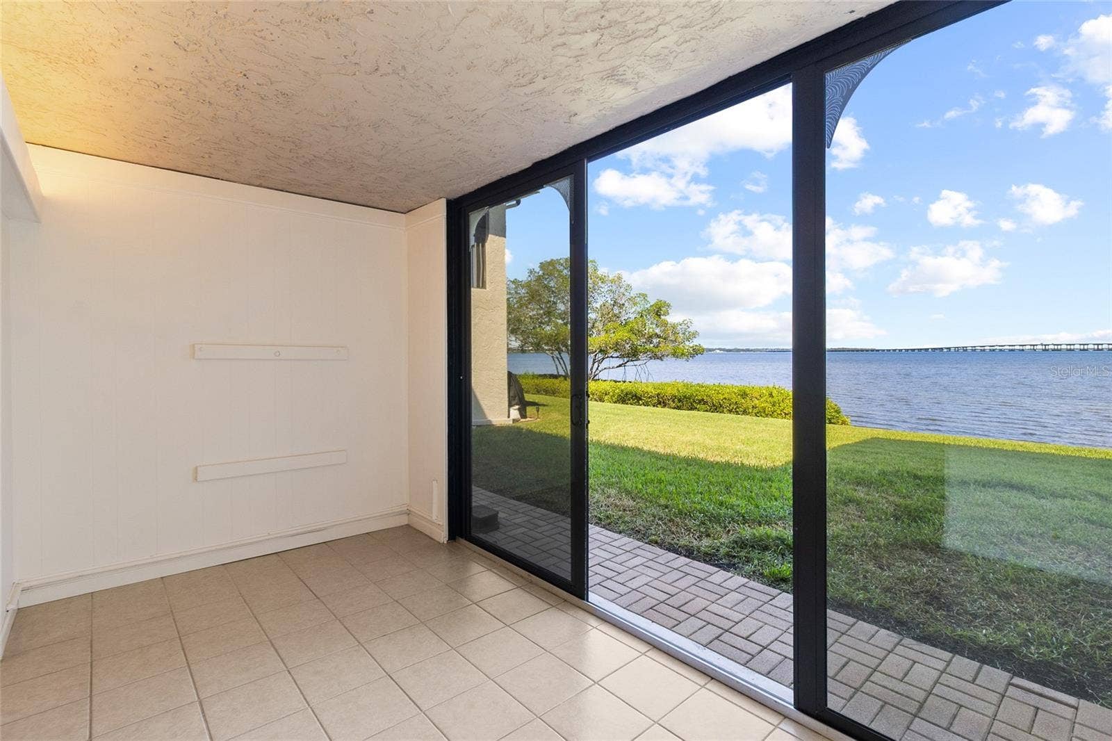 2980 HAINES BAYSHORE ROAD, #105, Clearwater, FL 33760 Sunroom with direct water views