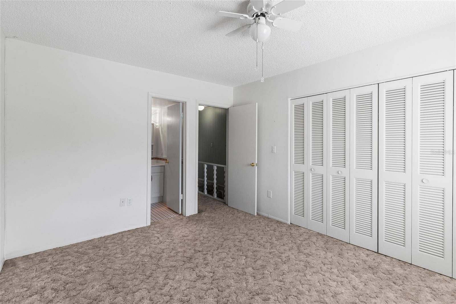 2980 HAINES BAYSHORE ROAD, #105, Clearwater, FL 33760 Scond bedroom looking toward private ensuite bath