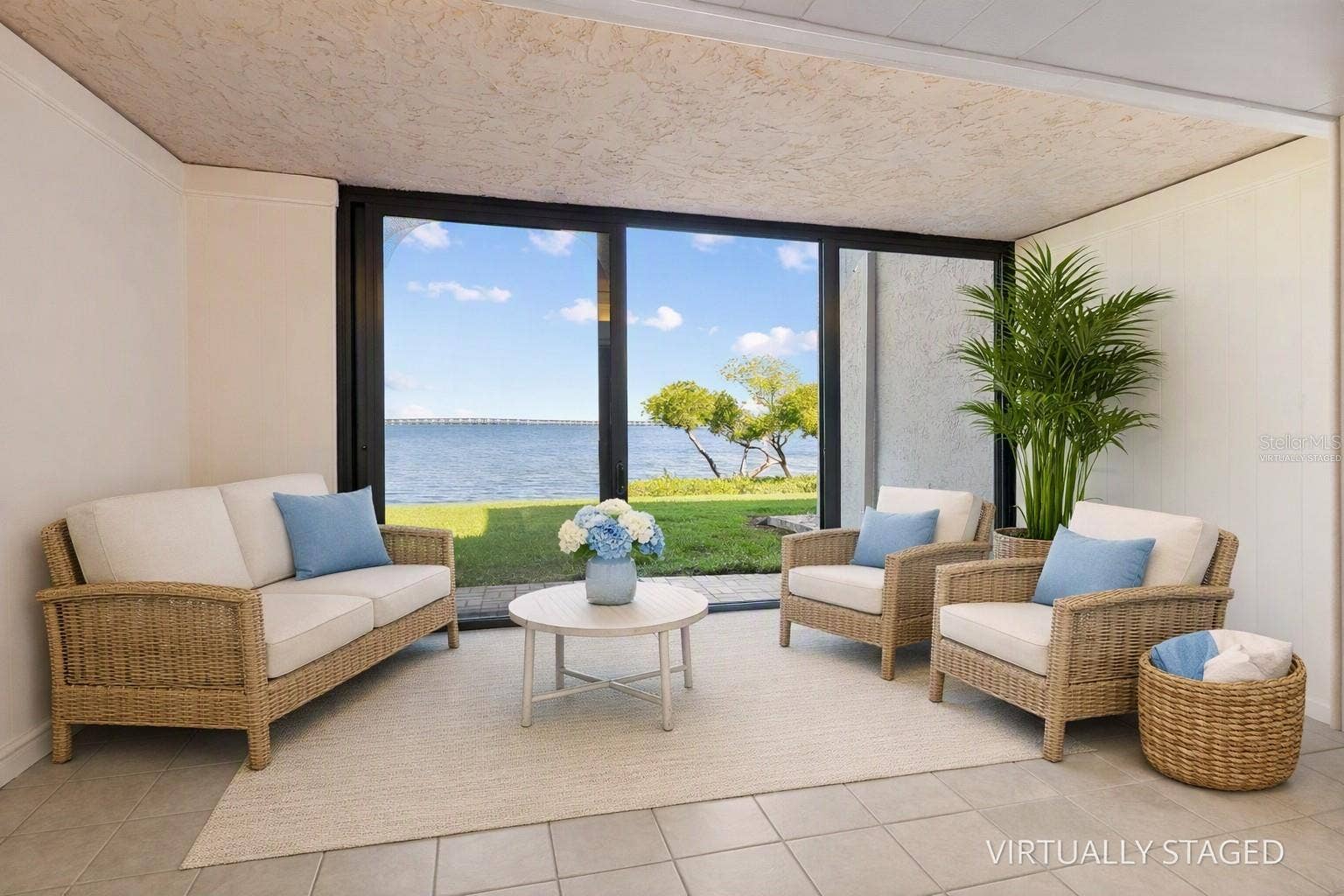 2980 HAINES BAYSHORE ROAD, #105, Clearwater, FL 33760 Virtually staged sunroom with full water view.