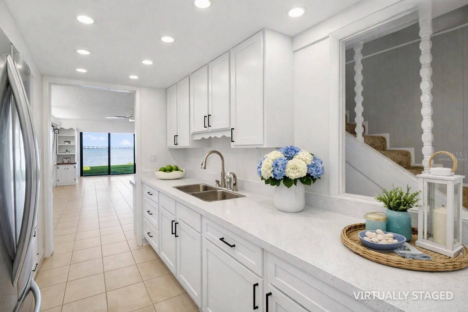 2980 HAINES BAYSHORE ROAD, #105, Clearwater, FL 33760 Virtually staged kitchem -to help envision recessed lighting, quart counter tops and white cabinets
