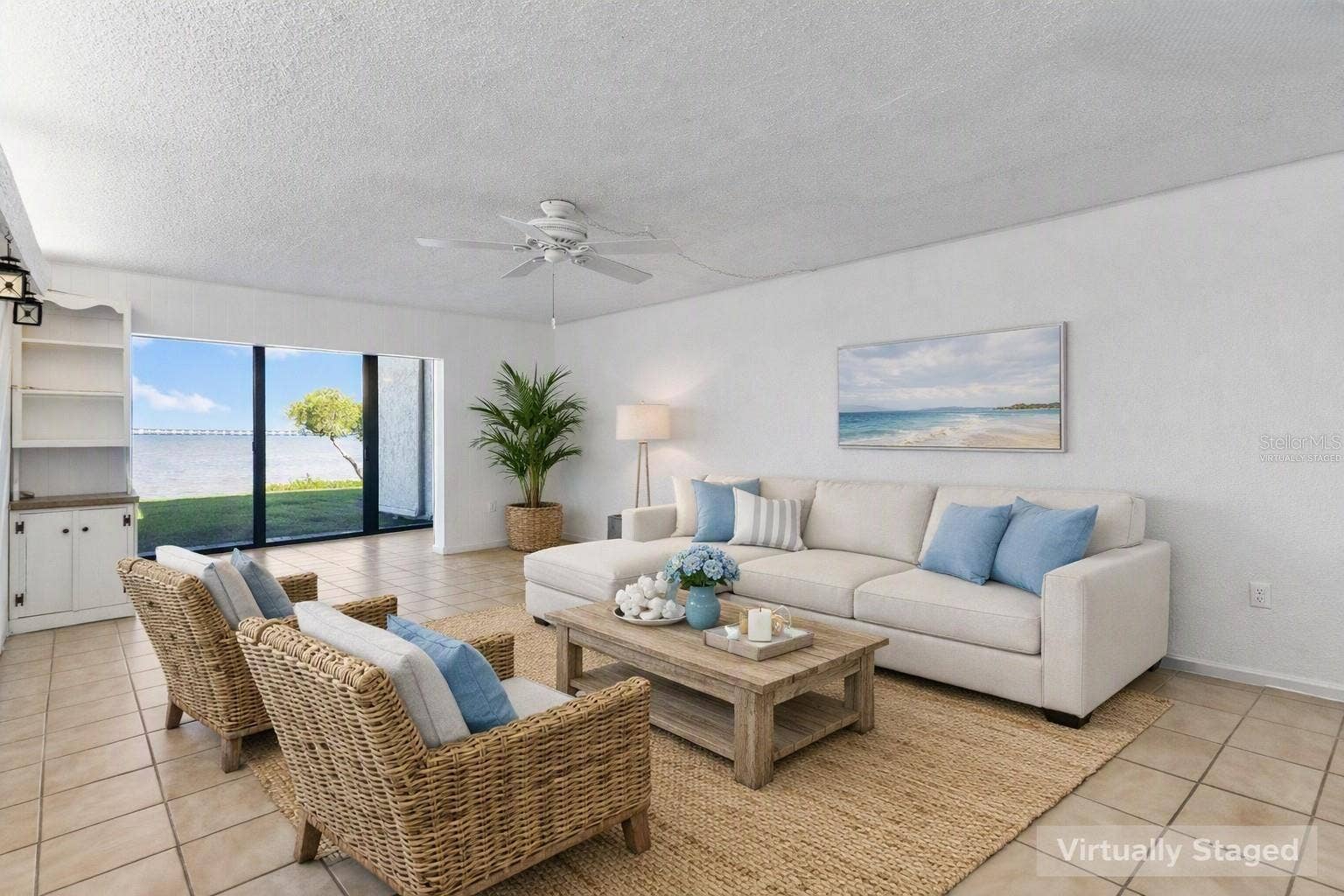 2980 HAINES BAYSHORE ROAD, #105, Clearwater, FL 33760 Virtually staged living area looking toward water view.