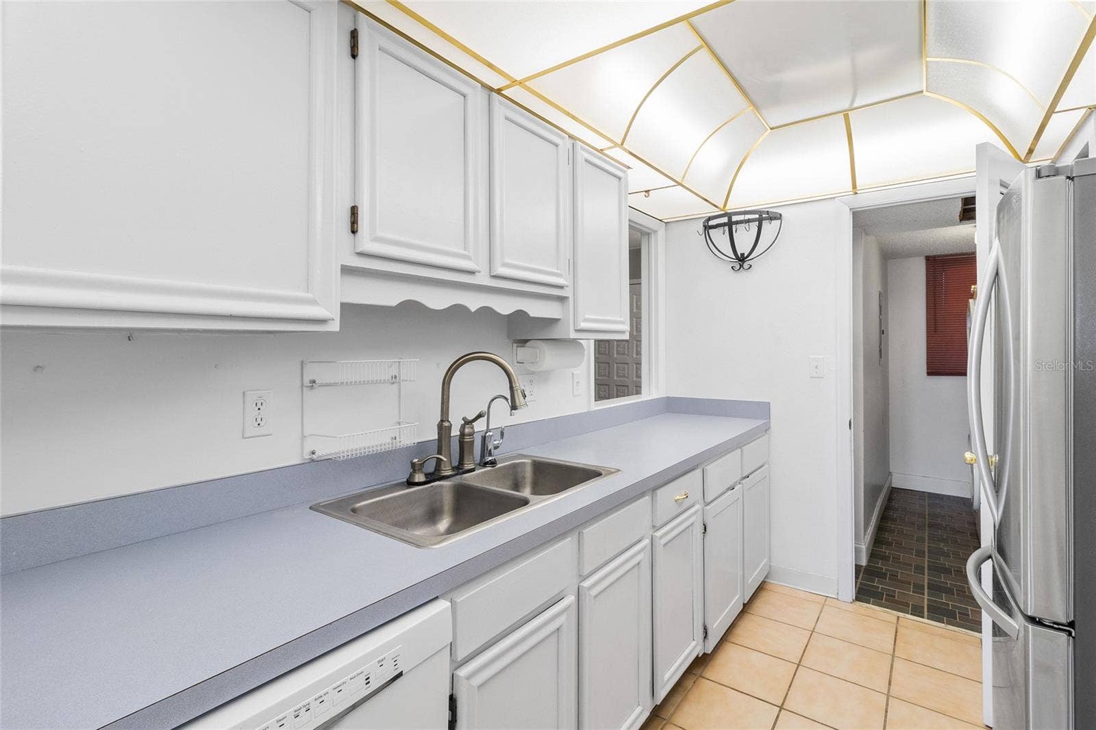 2980 HAINES BAYSHORE ROAD, #105, Clearwater, FL 33760 Kitchen looking toward interior laundry room