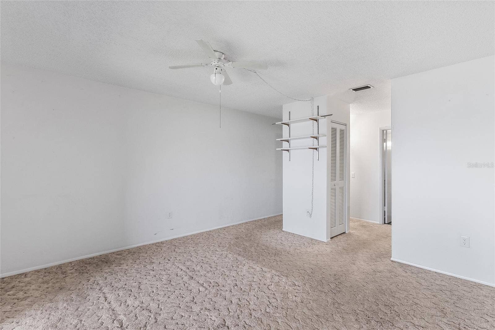 2980 HAINES BAYSHORE ROAD, #105, Clearwater, FL 33760 Primary suite looking toward closets and ensuite bath