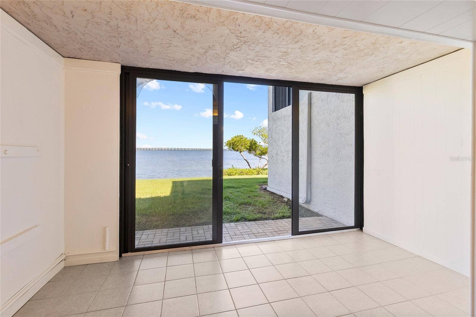 2980 HAINES BAYSHORE ROAD, #105, Clearwater, FL 33760 Sunroom directly off Living area - full water view.