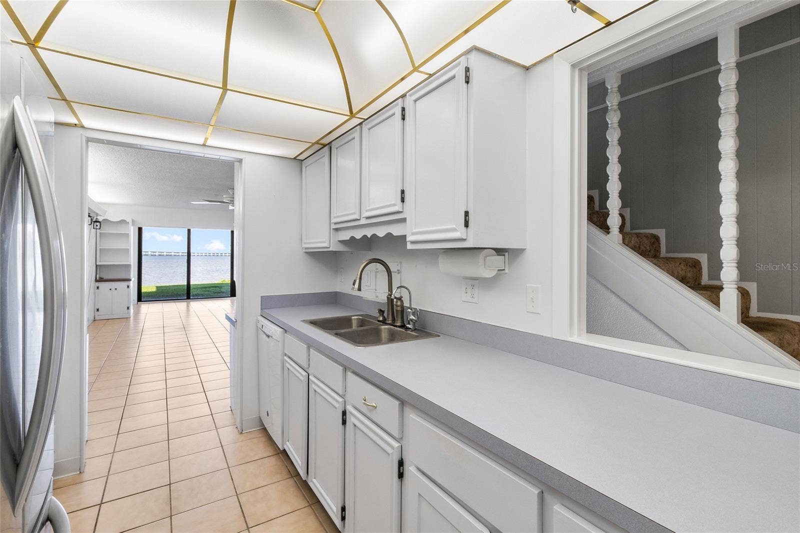 2980 HAINES BAYSHORE ROAD, #105, Clearwater, FL 33760 Kitchen other side looking toward living area and water view