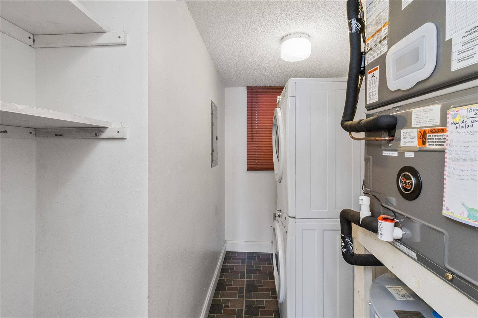 2980 HAINES BAYSHORE ROAD, #105, Clearwater, FL 33760 Interior laundry room - comes with washer and dryer