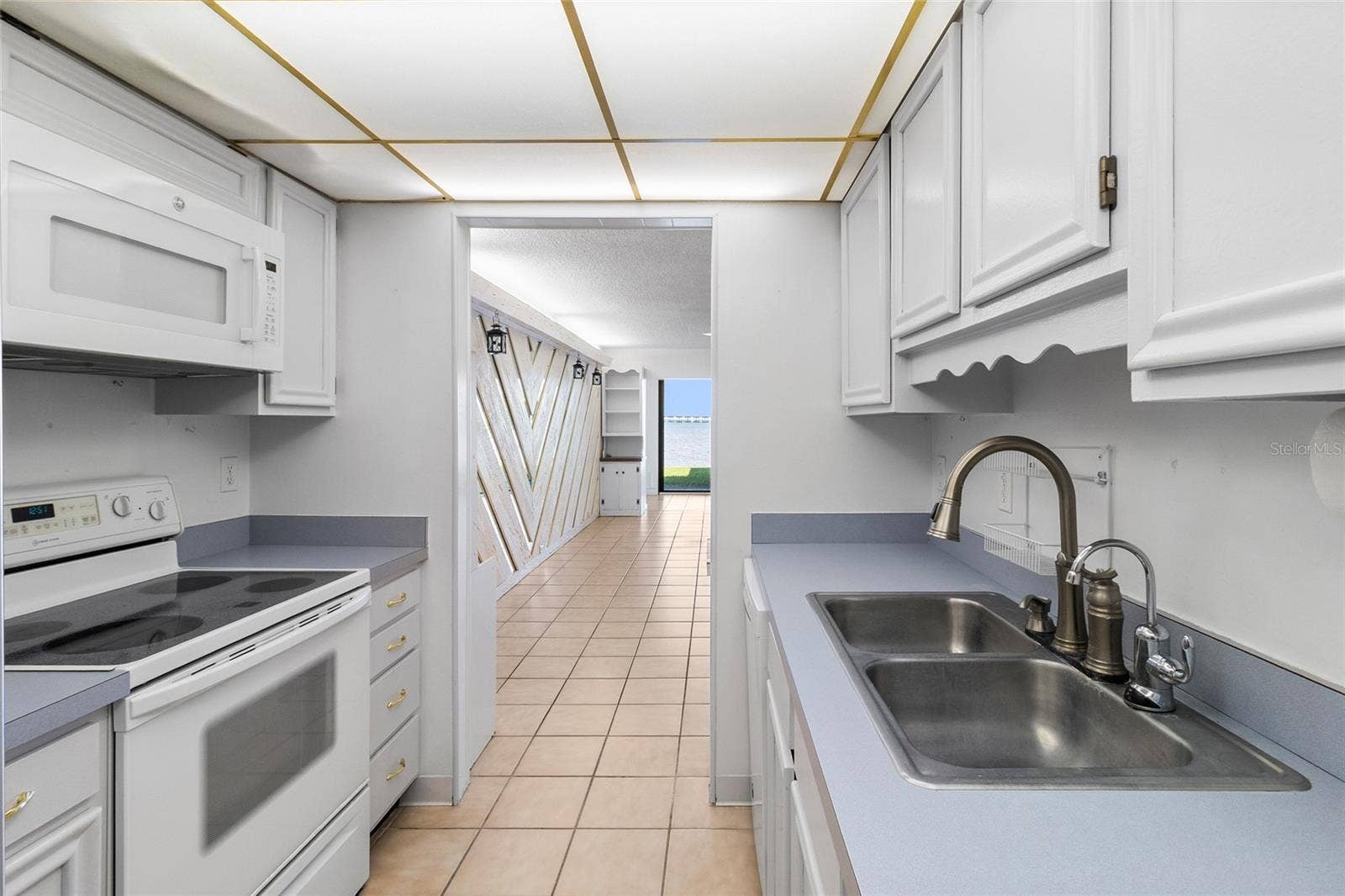 2980 HAINES BAYSHORE ROAD, #105, Clearwater, FL 33760 Kitchen looking towards the living area