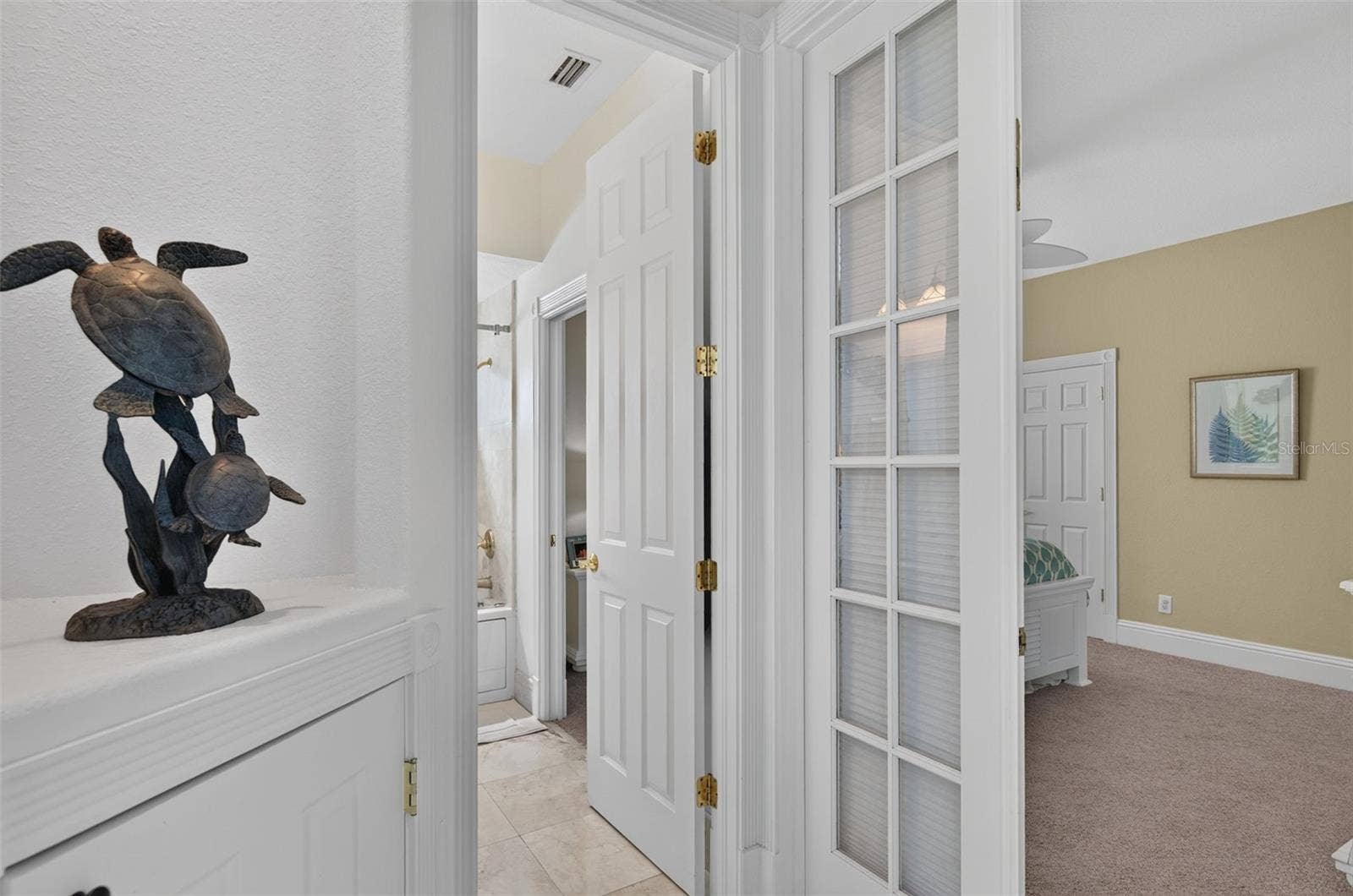 17021 DOLPHIN DRIVE, North Redington Beach, FL 33708 ENTRY BEDROOM 3 & SHARED GUEST BATH