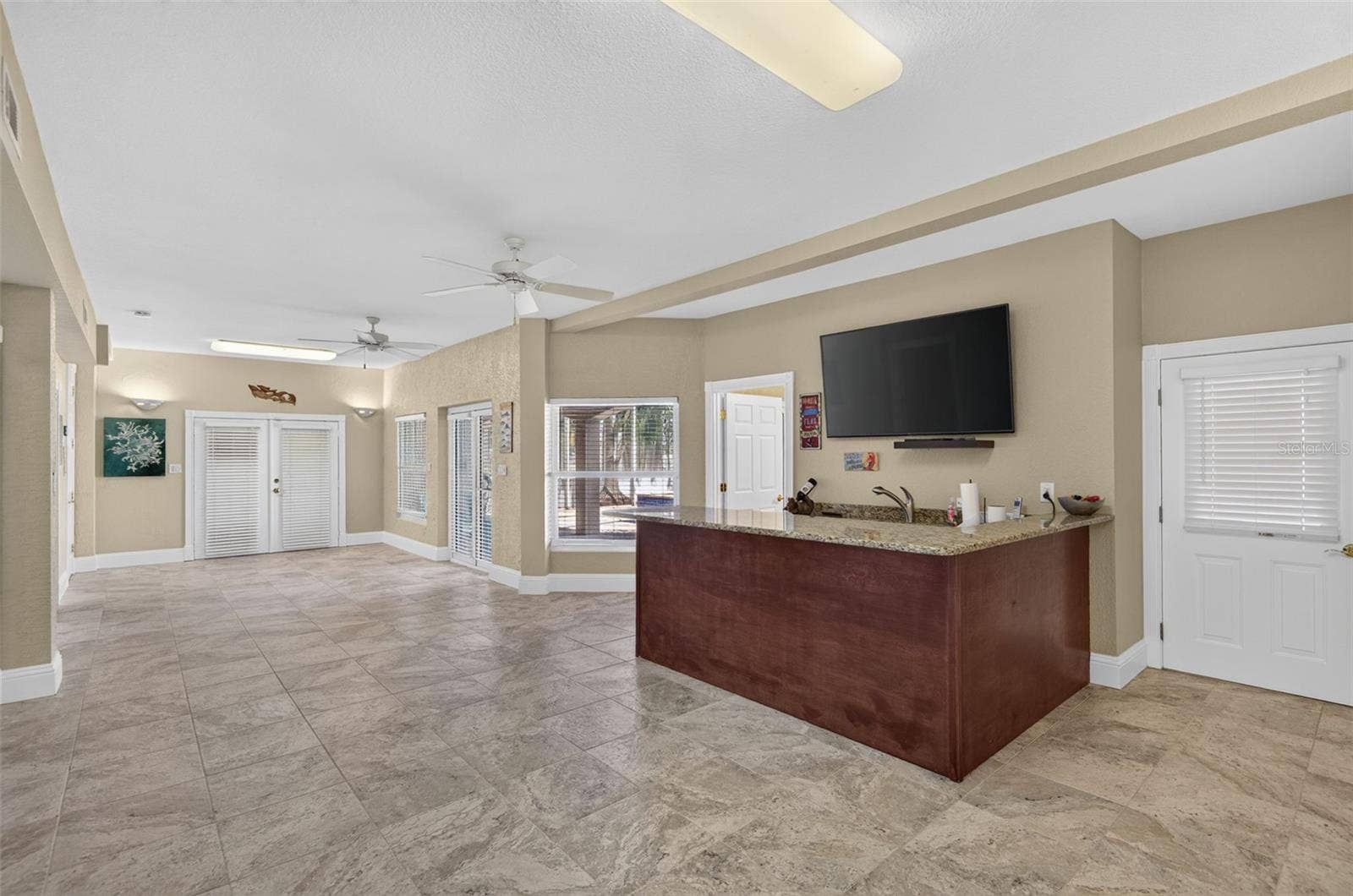 17021 DOLPHIN DRIVE, North Redington Beach, FL 33708 BONUS AREA BAR ELEVATOR ACCESS & DOORS TO EAST GARAGE