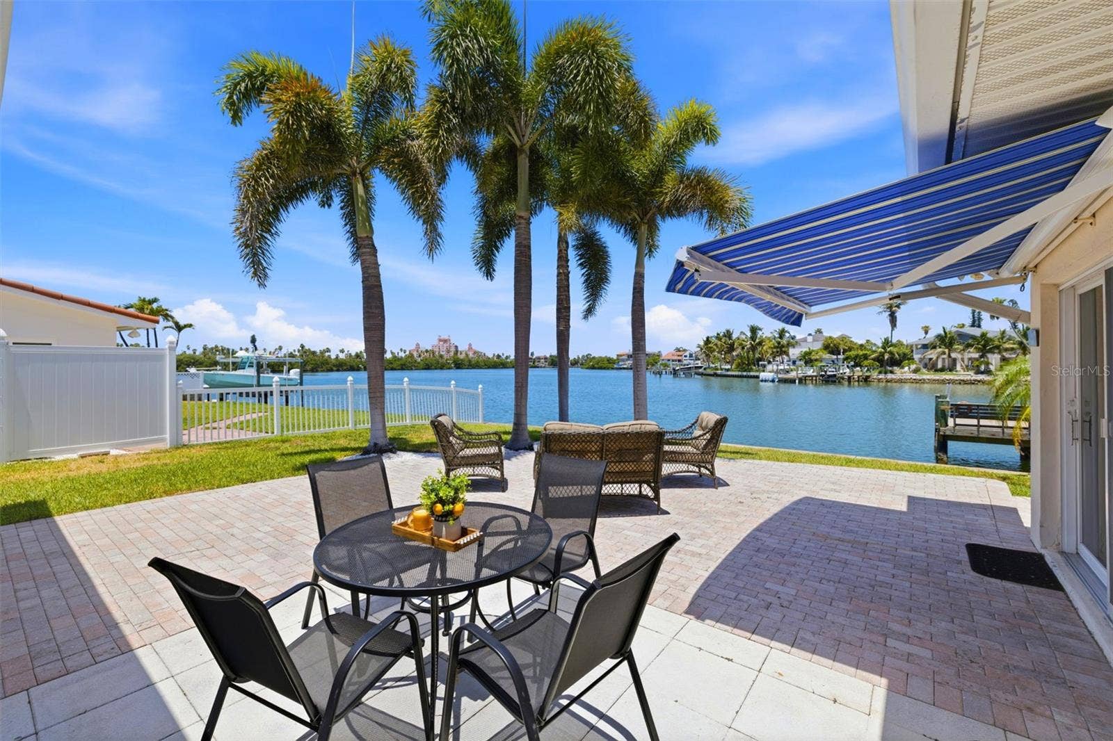 Backyard with large waterfront patio