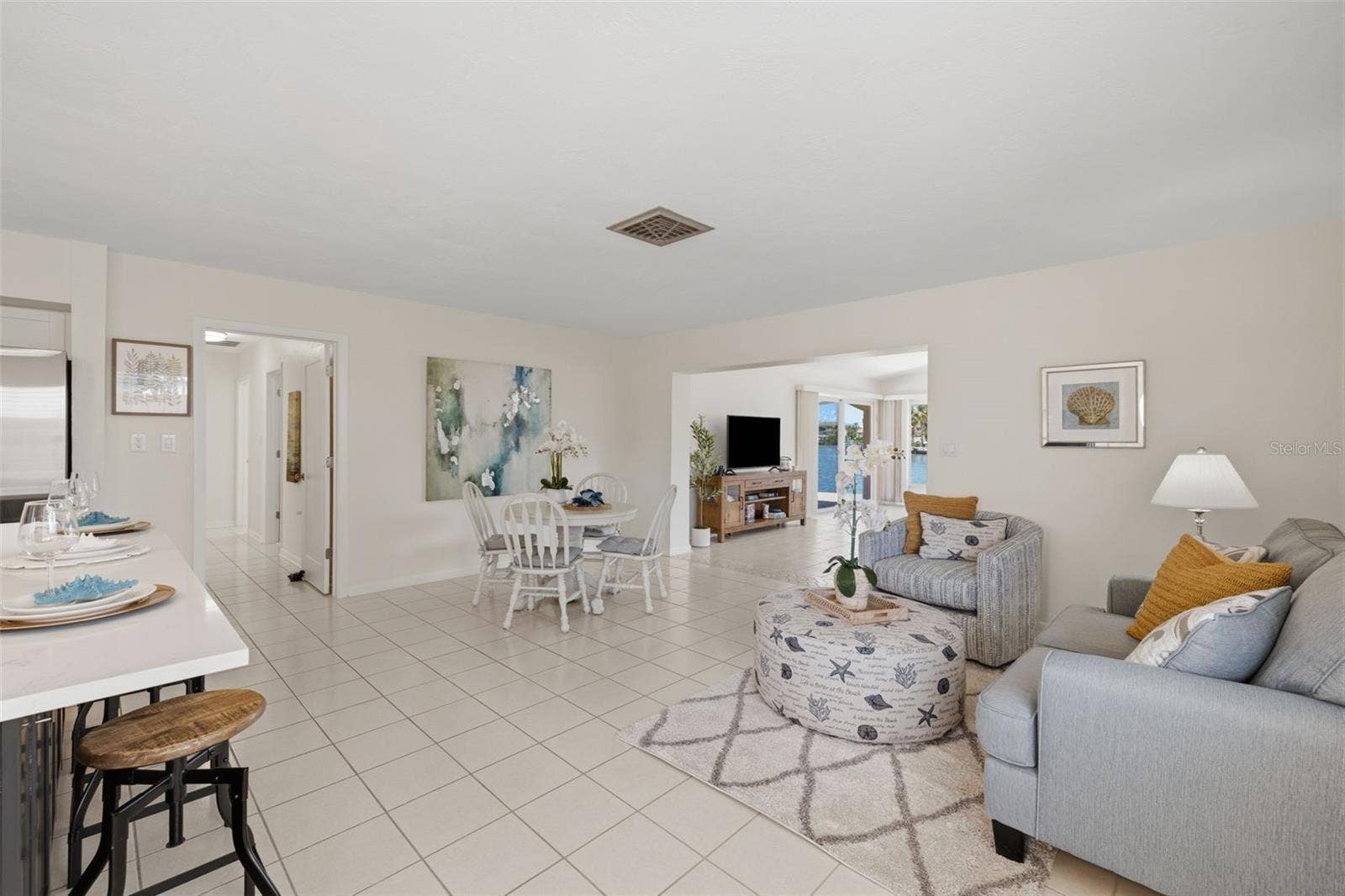 Enter into the kitchen, den and dining areas