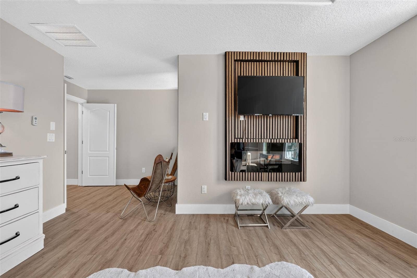 Primary bedroom electric fireplace