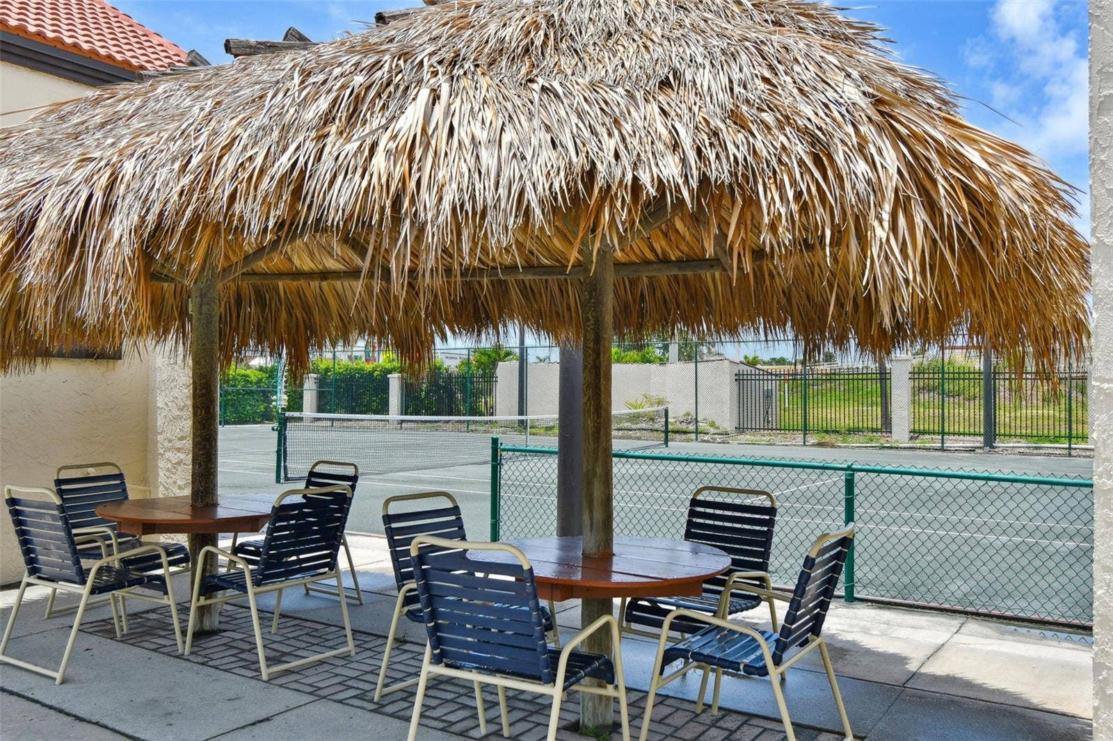 Tiki hut by tennis courts