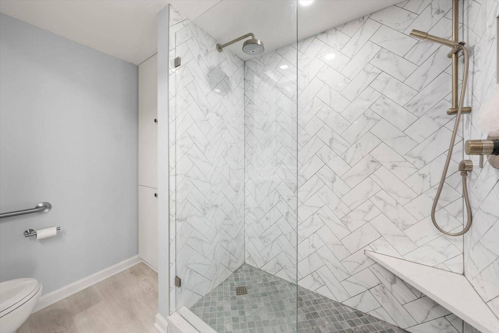 Exquisite shower in primary En suite bath is an oasis in itself.
