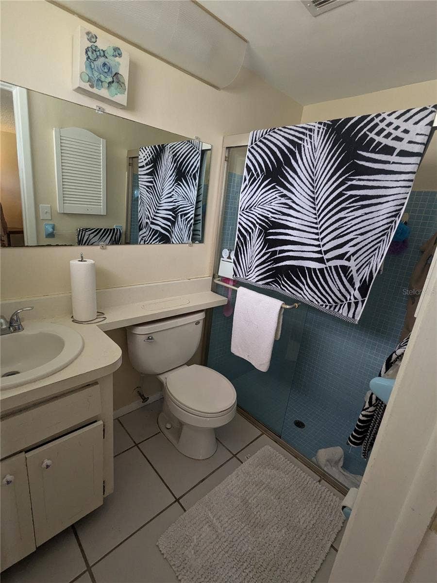 3937 SAIL DRIVE, New Port Richey, FL 34652 EN-SUITE BATH IN PRIMARY BEDROOM HAS GLASS SHOWER DOORS