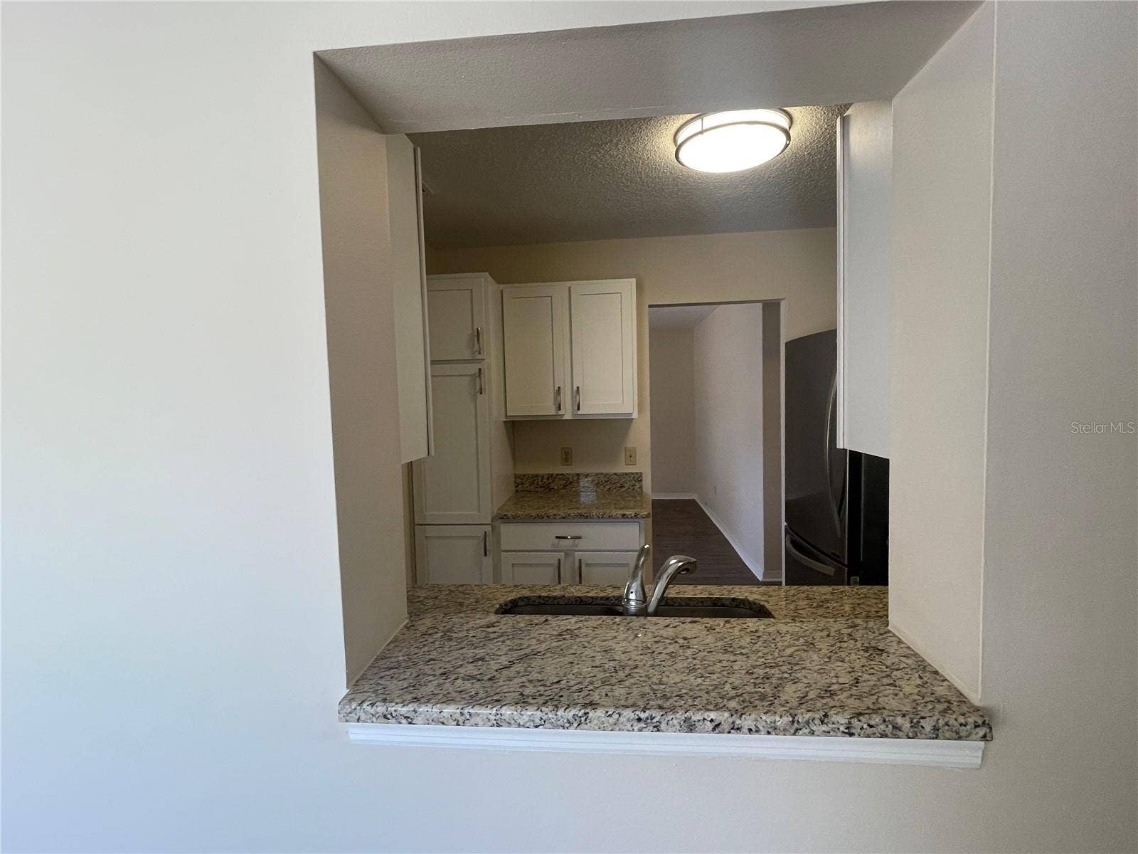 2232 GRENADIER DRIVE, #25, Sun City Center, FL 33573 Pass through from Florida Room to Kitchen
