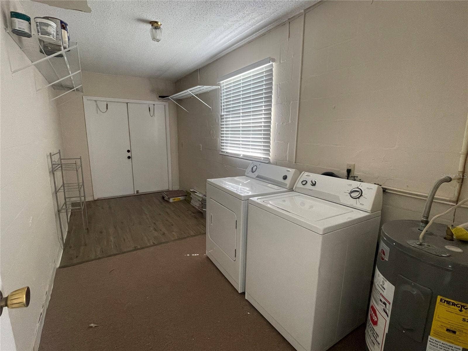 2232 GRENADIER DRIVE, #25, Sun City Center, FL 33573 Storage area/ laundry off Florida Room.