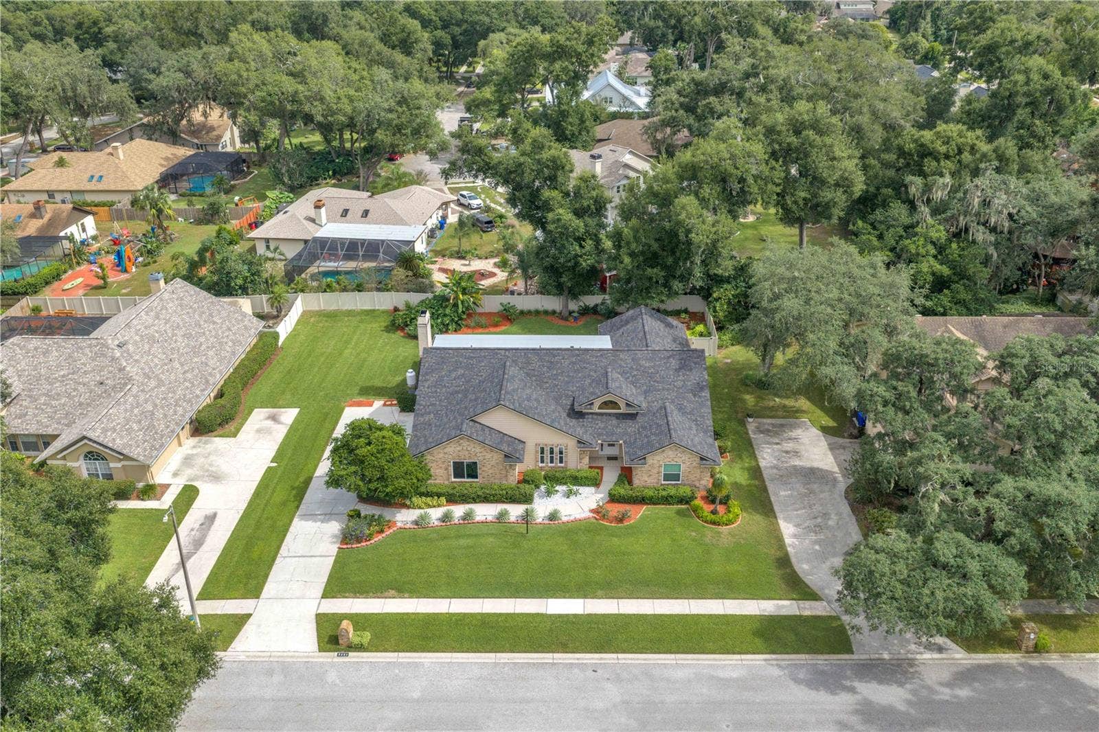 Nestled along a picturesque, tree-lined street surrounded by generously sized homesites, this stunning brick residence offers a rare combination of custom architecture and rich traditional details.
