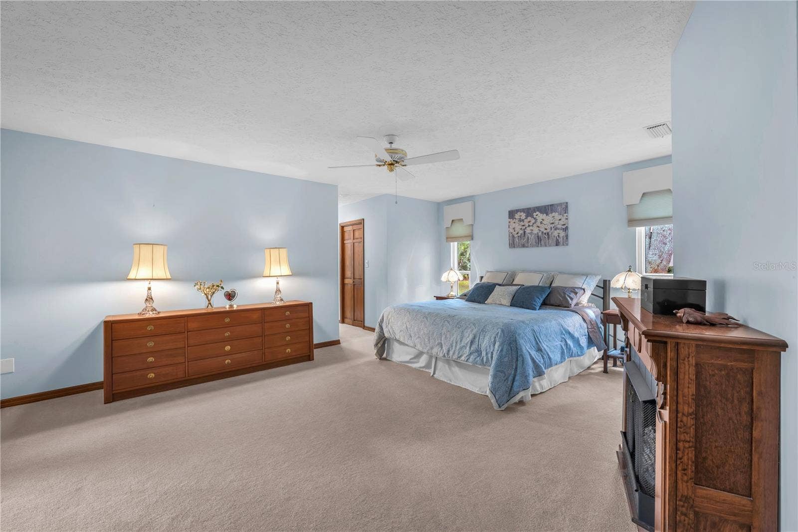 The large primary suite offers an ensuite with a relaxing tub, separate shower, and dual-sink vanity.