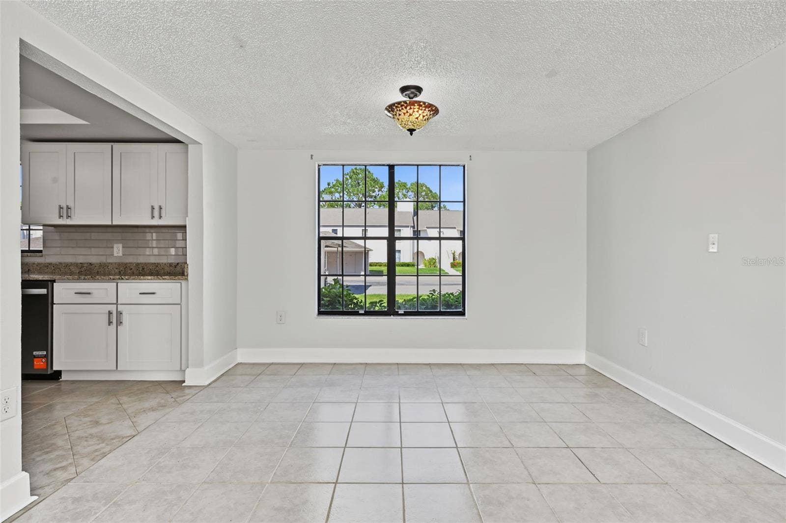 2460 HERON TERRACE, #102E, Clearwater, FL 33762 The Dining Area is just off the Kitchen and overlooks the Living Room. The windows truly provide significant natural light.
