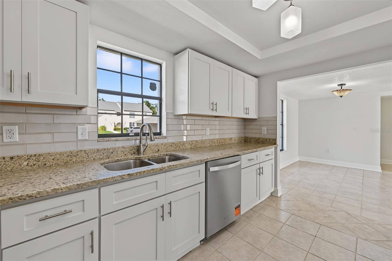 2460 HERON TERRACE, #102E, Clearwater, FL 33762 The Kitchen leads to the Dining Area