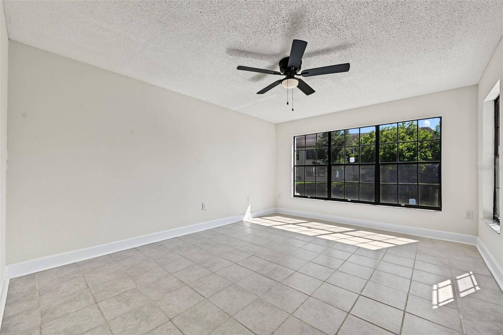 2460 HERON TERRACE, #102E, Clearwater, FL 33762 Primary Bedroom is very spacious with a large walk in closet and updated en suite bathroom