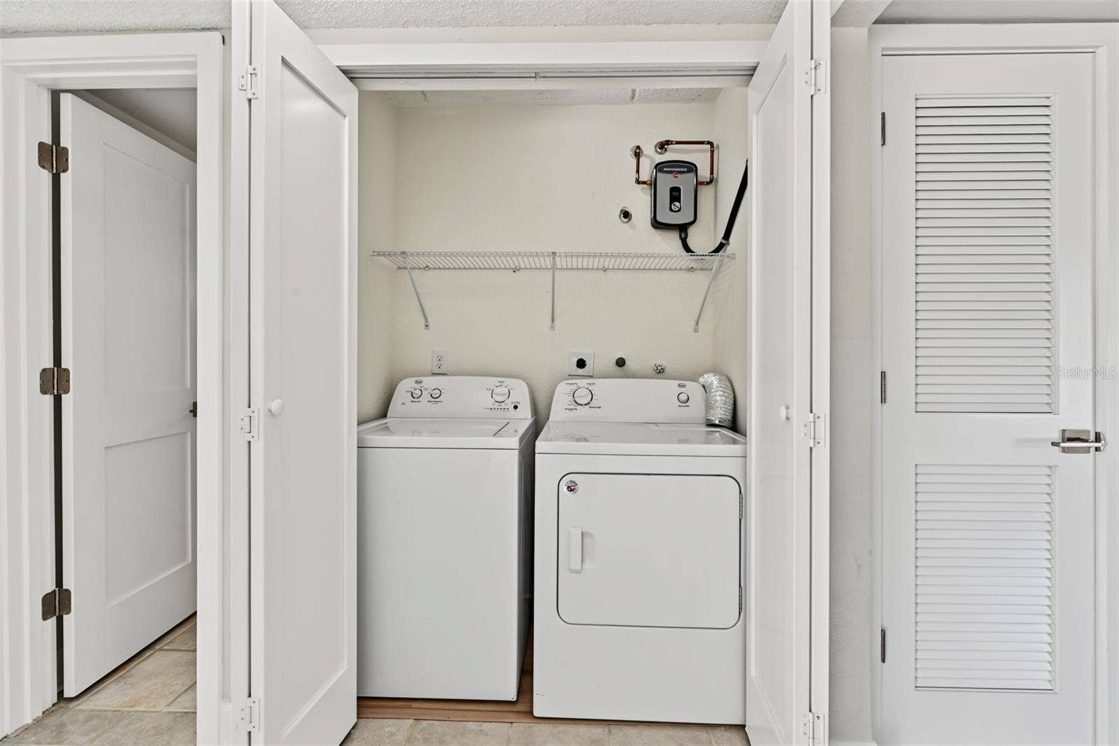2460 HERON TERRACE, #102E, Clearwater, FL 33762 Inside Laundry Closet
