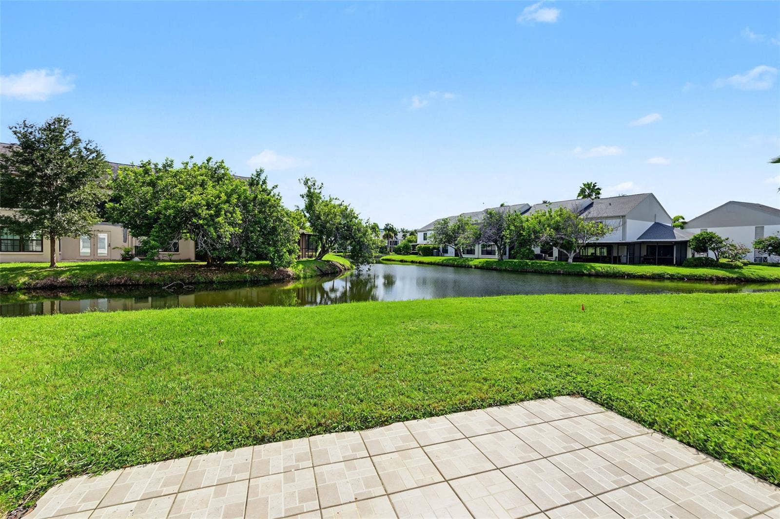 2460 HERON TERRACE, #102E, Clearwater, FL 33762 This 2 Bedroom, 2 Bath first floor condo has water views from the back sliders and both bedrooms providing natural light galore!